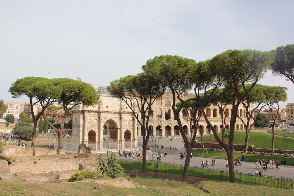 View of the Colosseum and the Arch of Constantine in Rome, Italy