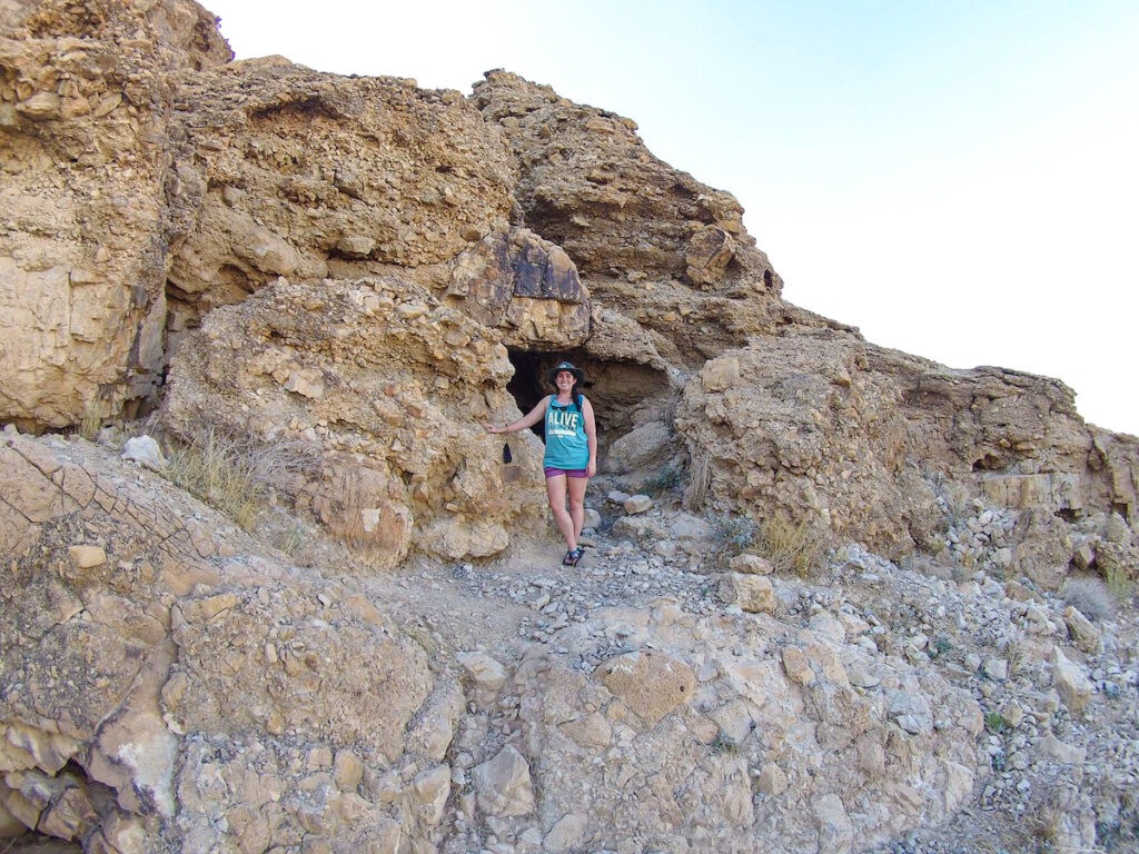 Sarah in front of a cave in Qumran where Dead Sea Scrolls were discovered