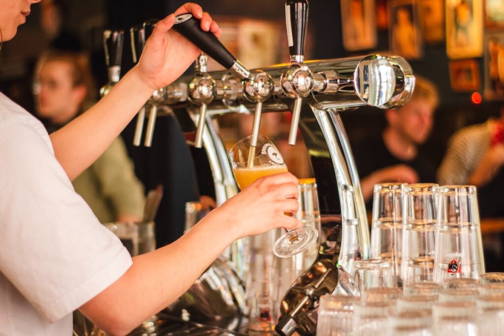 Oktoberfest brewery - someone pouring a beer from the tap